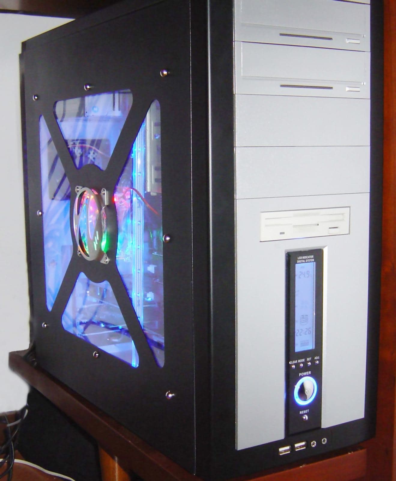 Interior of an open desktop PC tower case showing internal components during a computer repair